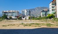 AL-1652-1, Coastal Living in Alanya Kestel – 3-Room Apartment with Distant Sea View, Pool & Prime Location Near the Beach