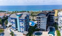 AL-2129, Right on the Sea: 2023-Built Furnished 55 m² 1+1 with Pool, Sauna and Gym, Kargıcak
