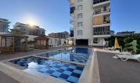 AL-2166, Only 150 m to the Beach – Furnished 60 m² 1+1 with Underfloor Heating, Pool, Sauna and Gym, Kargıcak