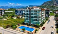 AL-2169, Sea, Pool and Mountain Views from a Huge Balcony – Furnished 72 m² 1+1 with Sauna and Fitness, Kestel